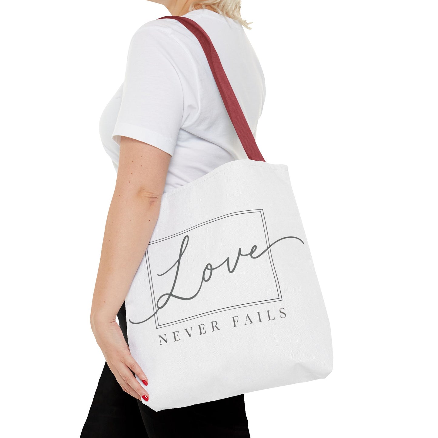 Love Never Fails Tote Bag