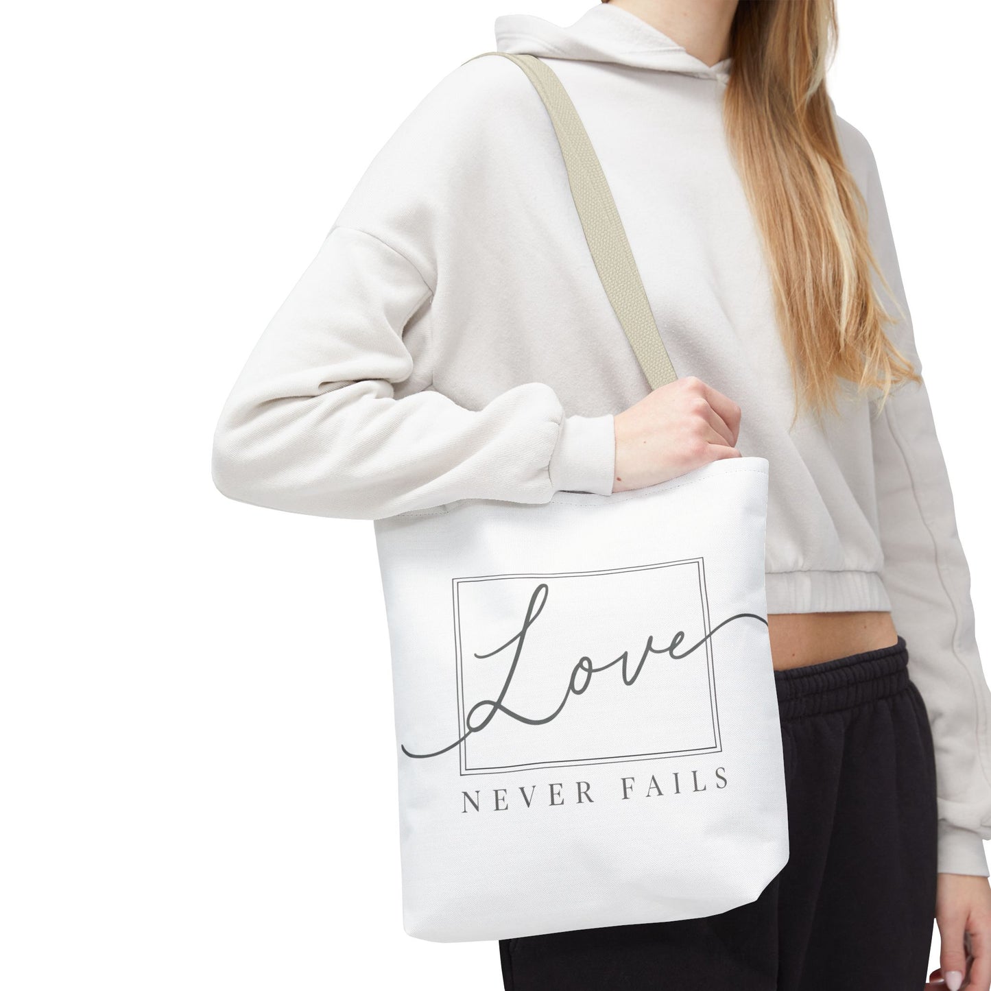Love Never Fails Tote Bag