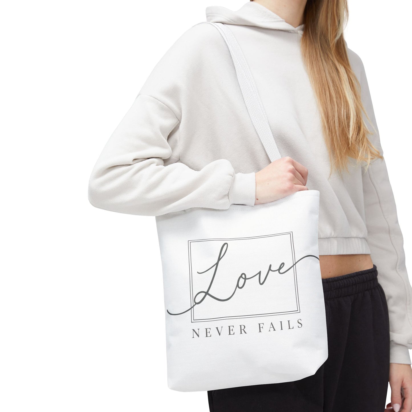 Love Never Fails Tote Bag