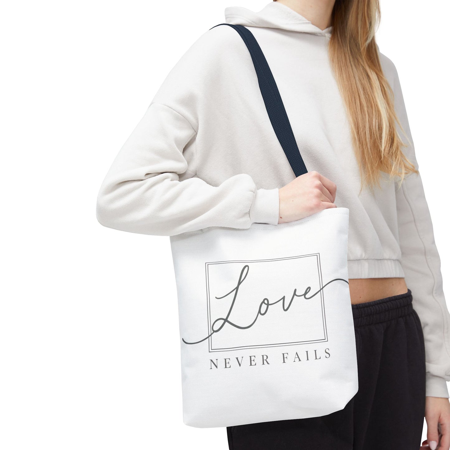 Love Never Fails Tote Bag