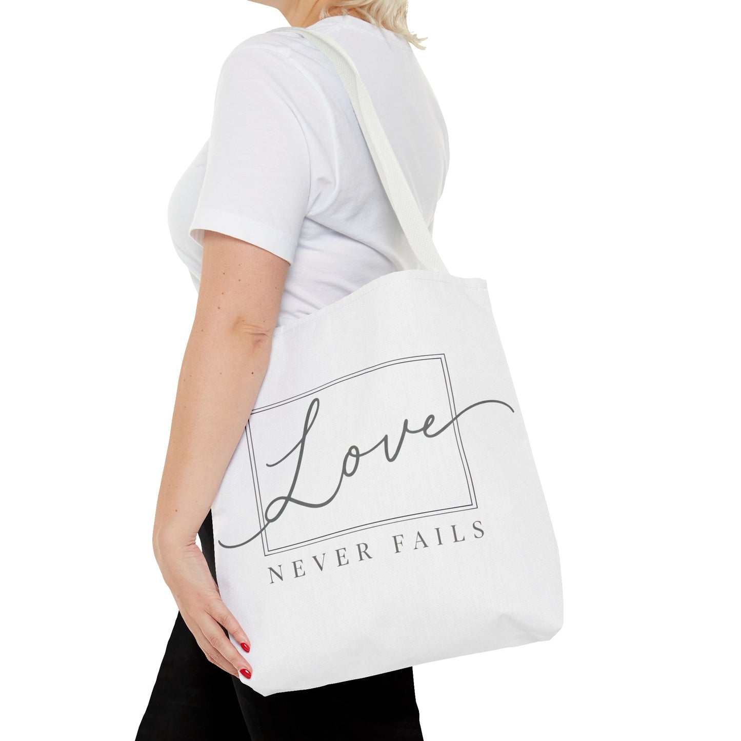 Love Never Fails Tote Bag
